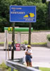 Kathy by the 'Welcome to Kentucky' sign