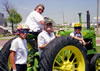 Cindy, Mary Anne, Bill and Kathy strike a pose with John Deere